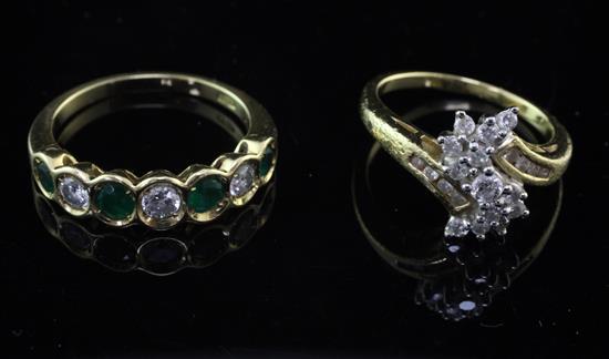 An 18ct gold and seven stone emerald and diamond half hoop ring and an 18ct gold and diamond cluster ring, sizes N & K.